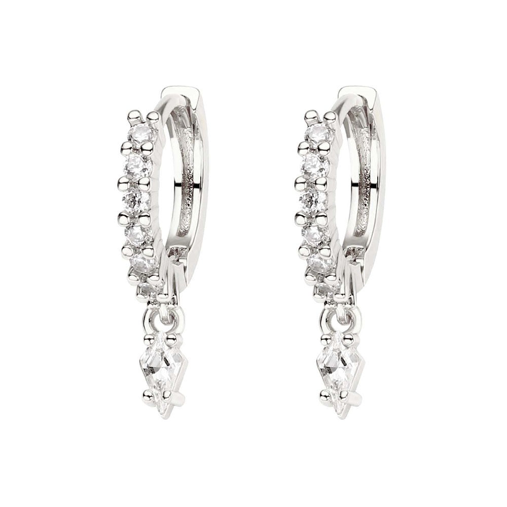 Pair of silver hoop earrings with clear gemstones on a white background