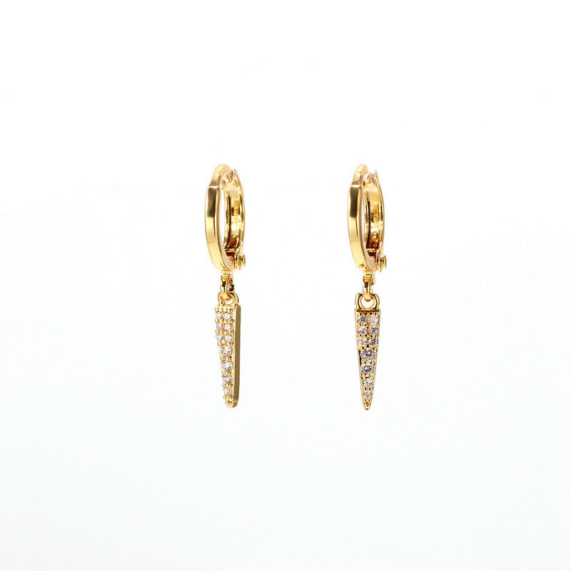 Gold hoop earrings with small diamond-like stones on a white background
