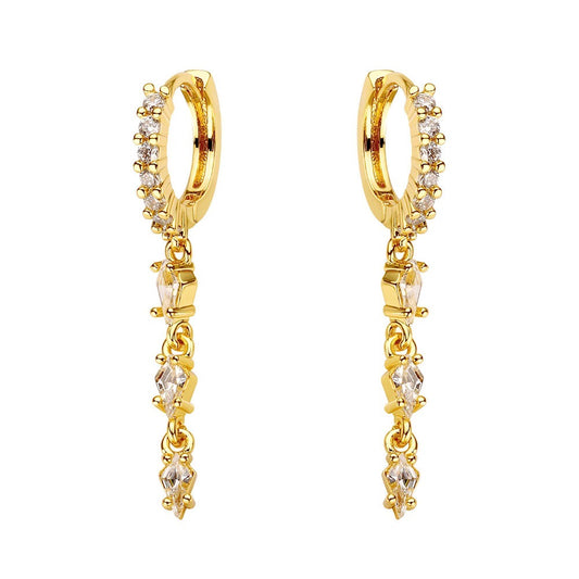 Gold hoop earrings with small diamonds on a white background