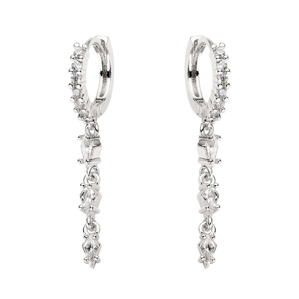 Silver hoop earrings with clear gemstones on a white background