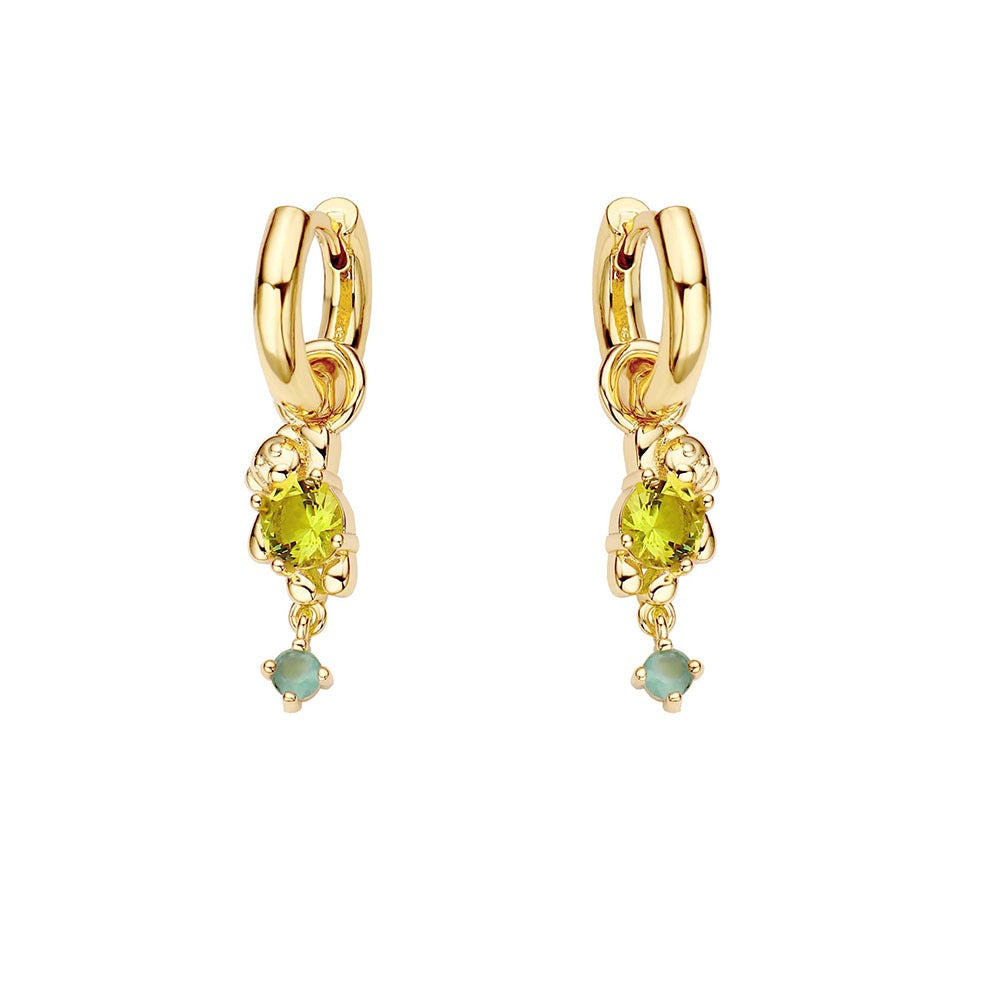 Gold hoop earrings with green gemstones on a white background