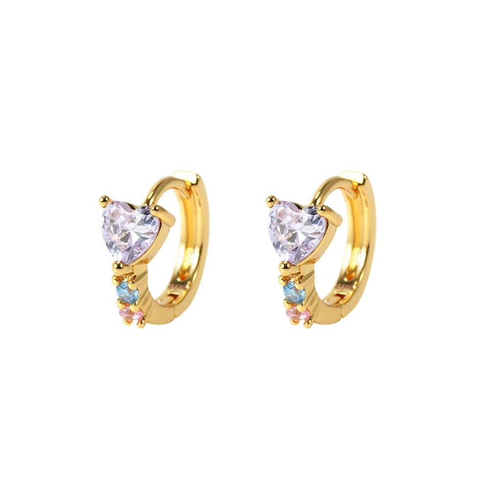 Gold hoop earrings with heart-shaped and round gemstones on a white background
